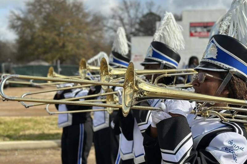 Murrah High School’s trombone players standing in formation.