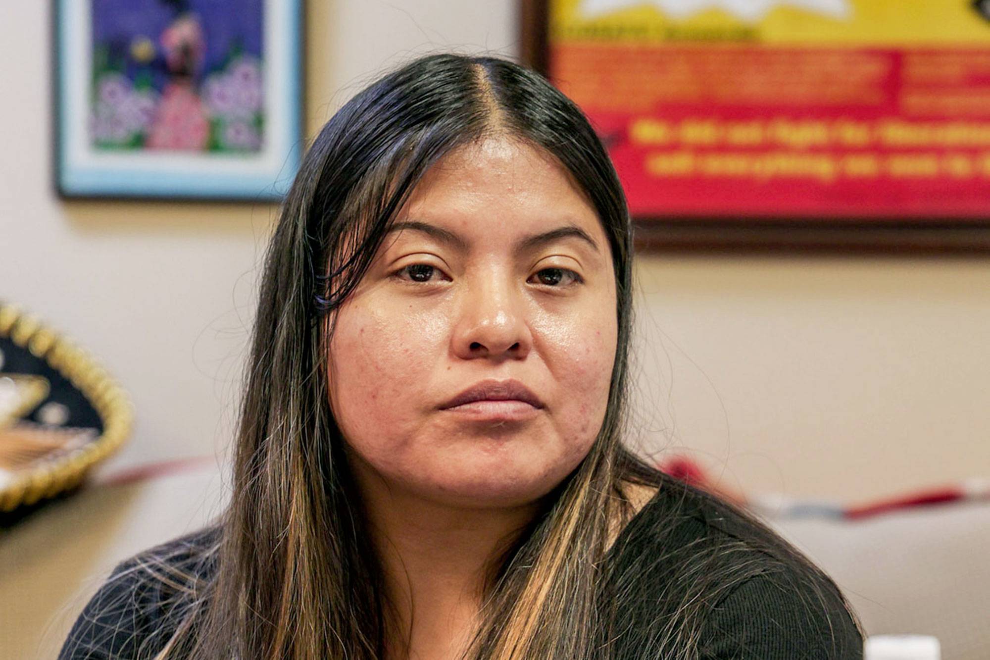 Woman posing for a headshot at MIRA Office.