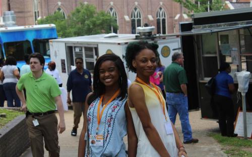 YMP students Maisie Brown, left, and Aja Purvis at Food Truck Friday in Smith Park.