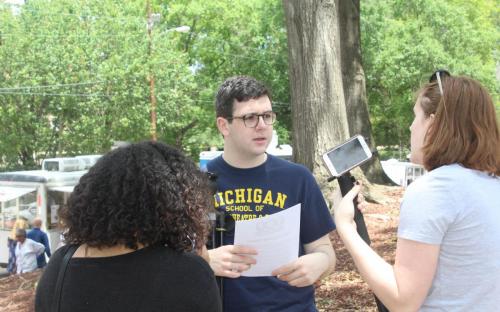 YMP students interview peers at the Food Truck Friday in Smith Park. 