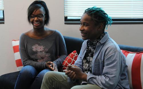 YMP students Minia Johnson and Kenytta Brown ask each other questions as part of the introductory course to successful interviewing practices. 